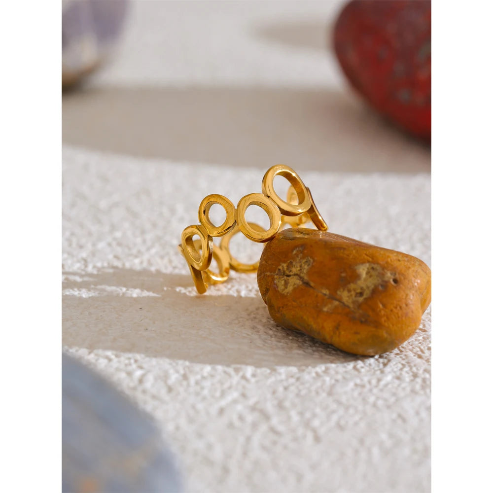 Geometric ring in 18K gold-plated stainless steel.
