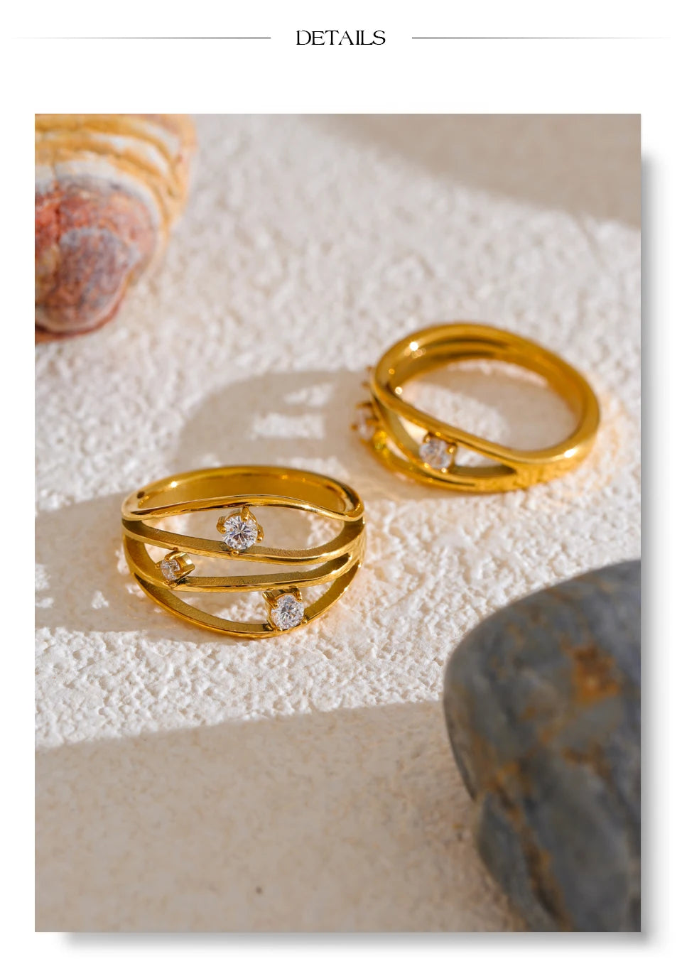 Cubic zirconia geometric ring in 18K gold-plated stainless steel with cubic zirconia.
