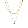 Geometric chain layered necklace in gold-plated stainless steel.