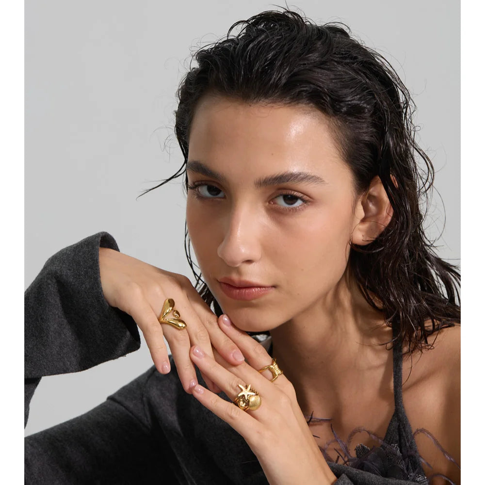 Geometric ring in gold-plated stainless steel.