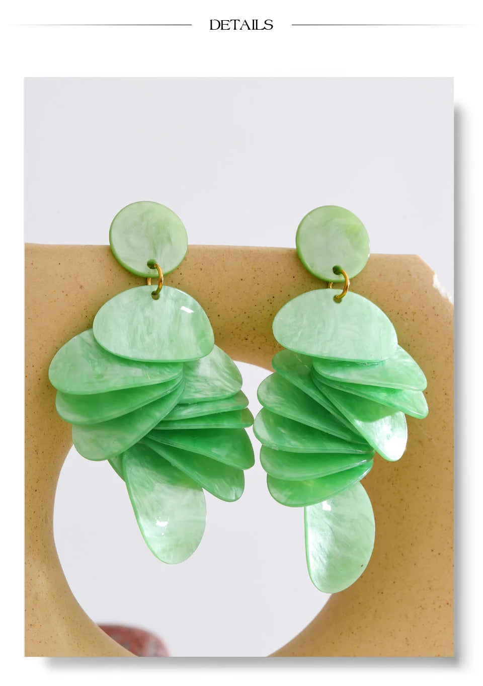 Green acrylic geometric earrings in gold-plated stainless steel with acrylic.