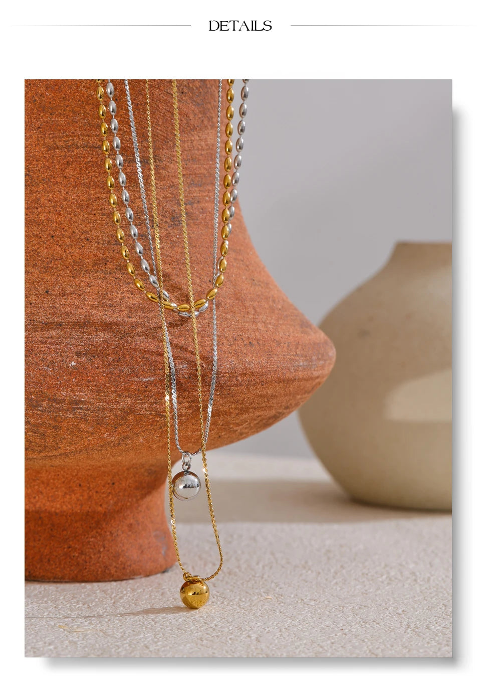 Geometric chain layered necklace in gold-plated stainless steel.