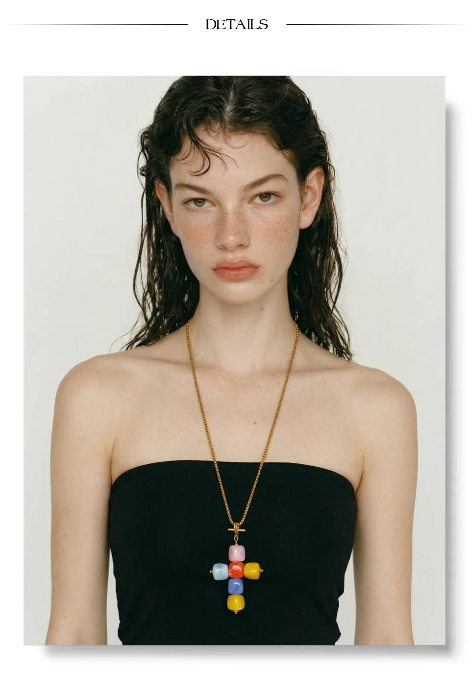 Resin acrylic cross necklace in gold-plated stainless steel with resin and acrylic.