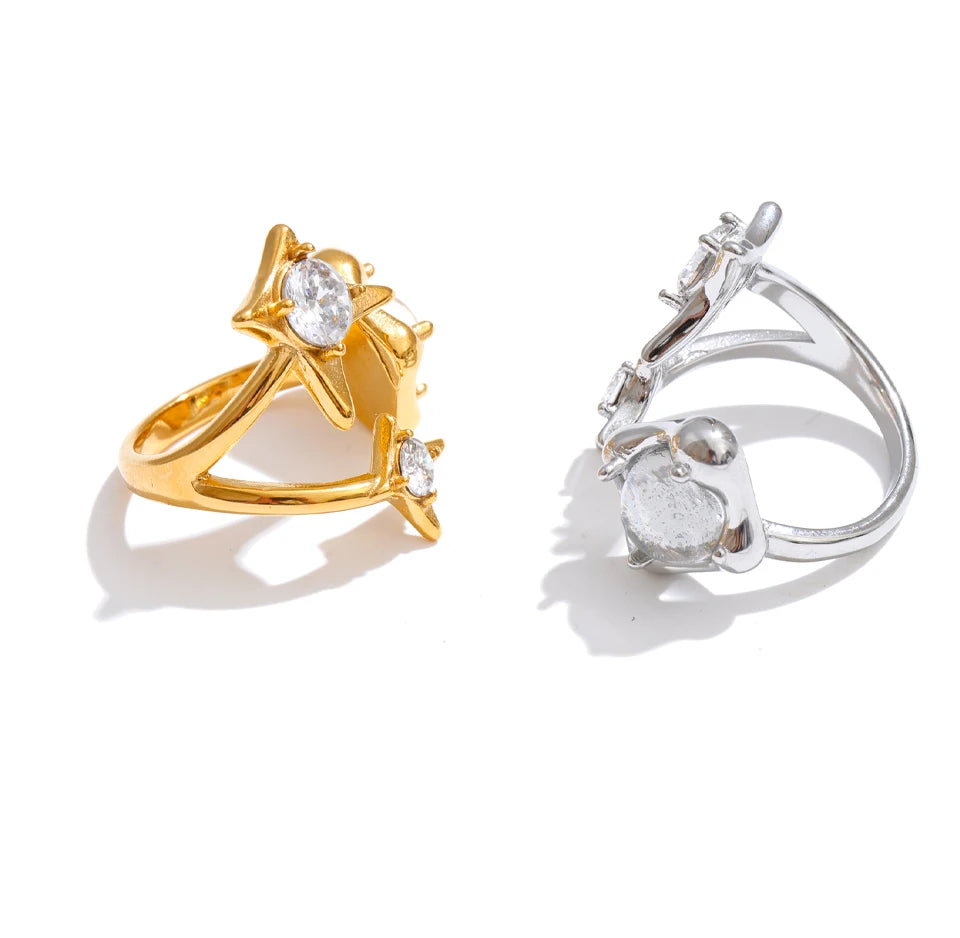 Cubic zirconia geometric ring in 18K gold-plated stainless steel with cubic zirconia.