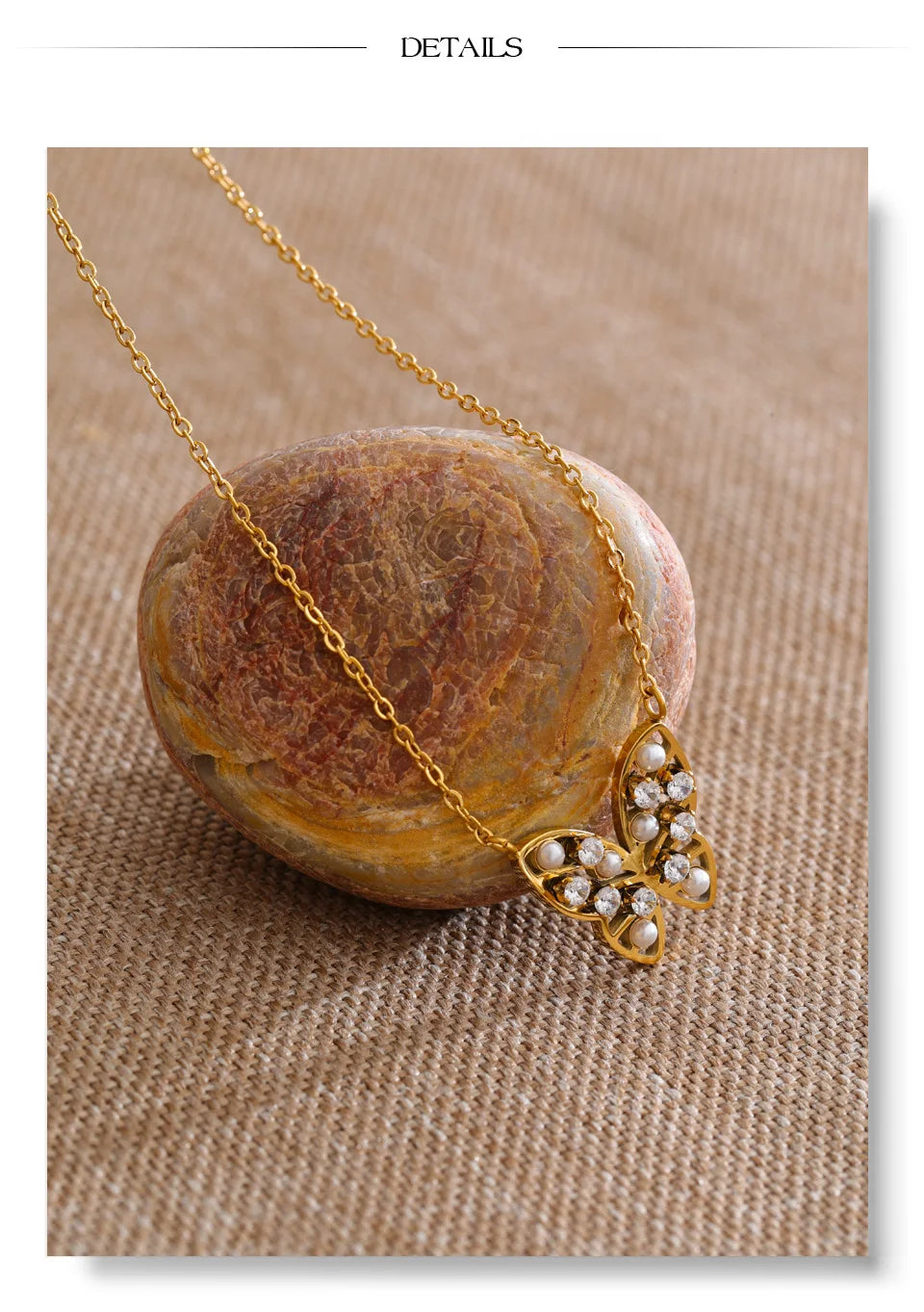 Cubic zirconia pearl butterfly necklace in gold-plated stainless steel with pearl and cubic zirconia.