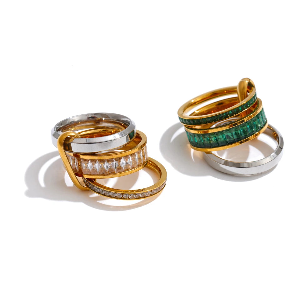 Cubic zirconia geometric layered ring in 18K gold-plated stainless steel with cubic zirconia.