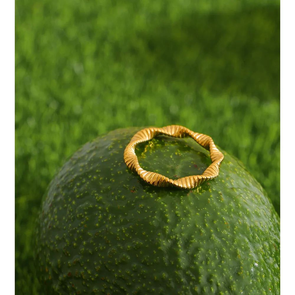 Geometric ring in 18K gold-plated stainless steel.