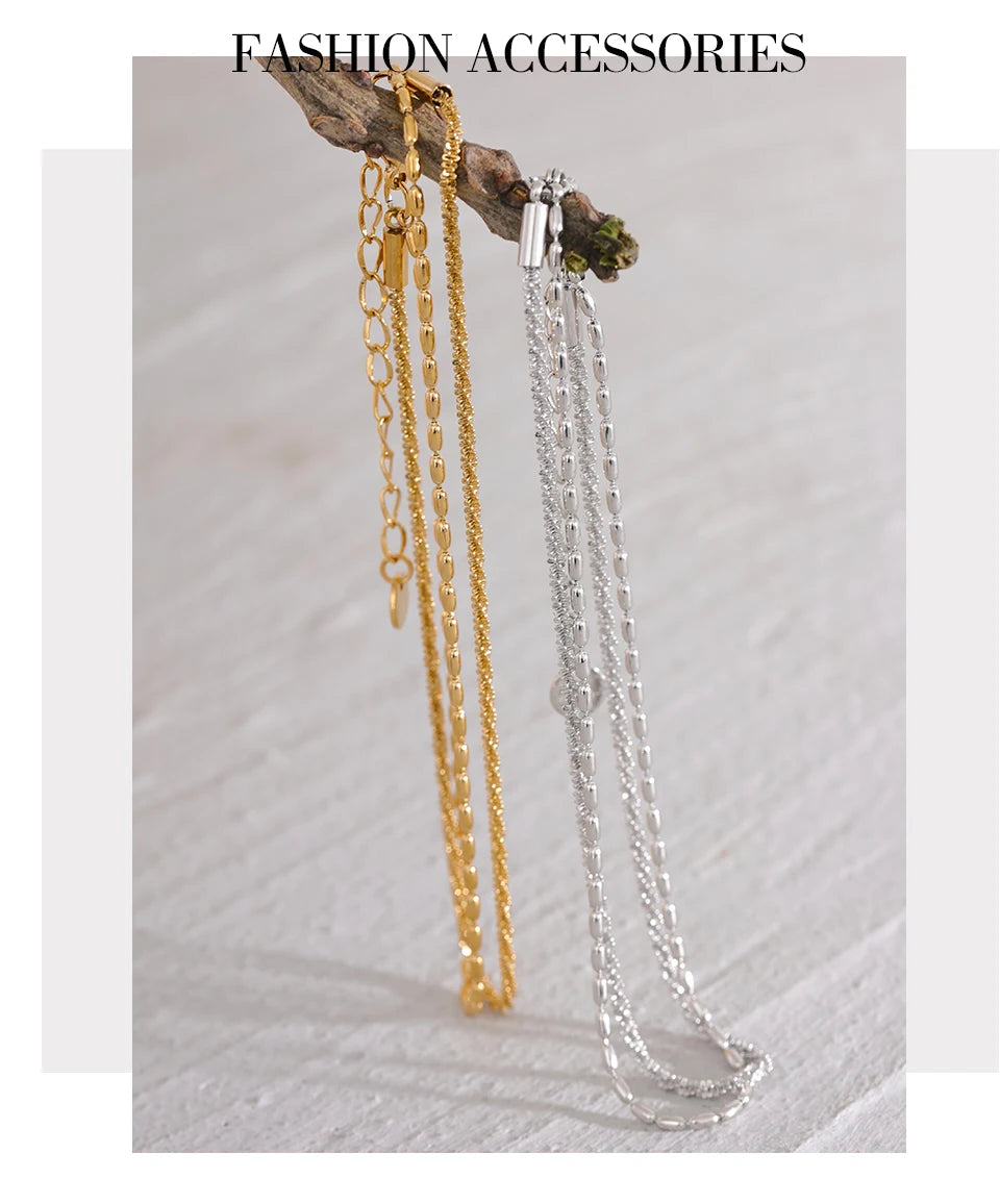 Geometric chain layered necklace in gold-plated stainless steel.