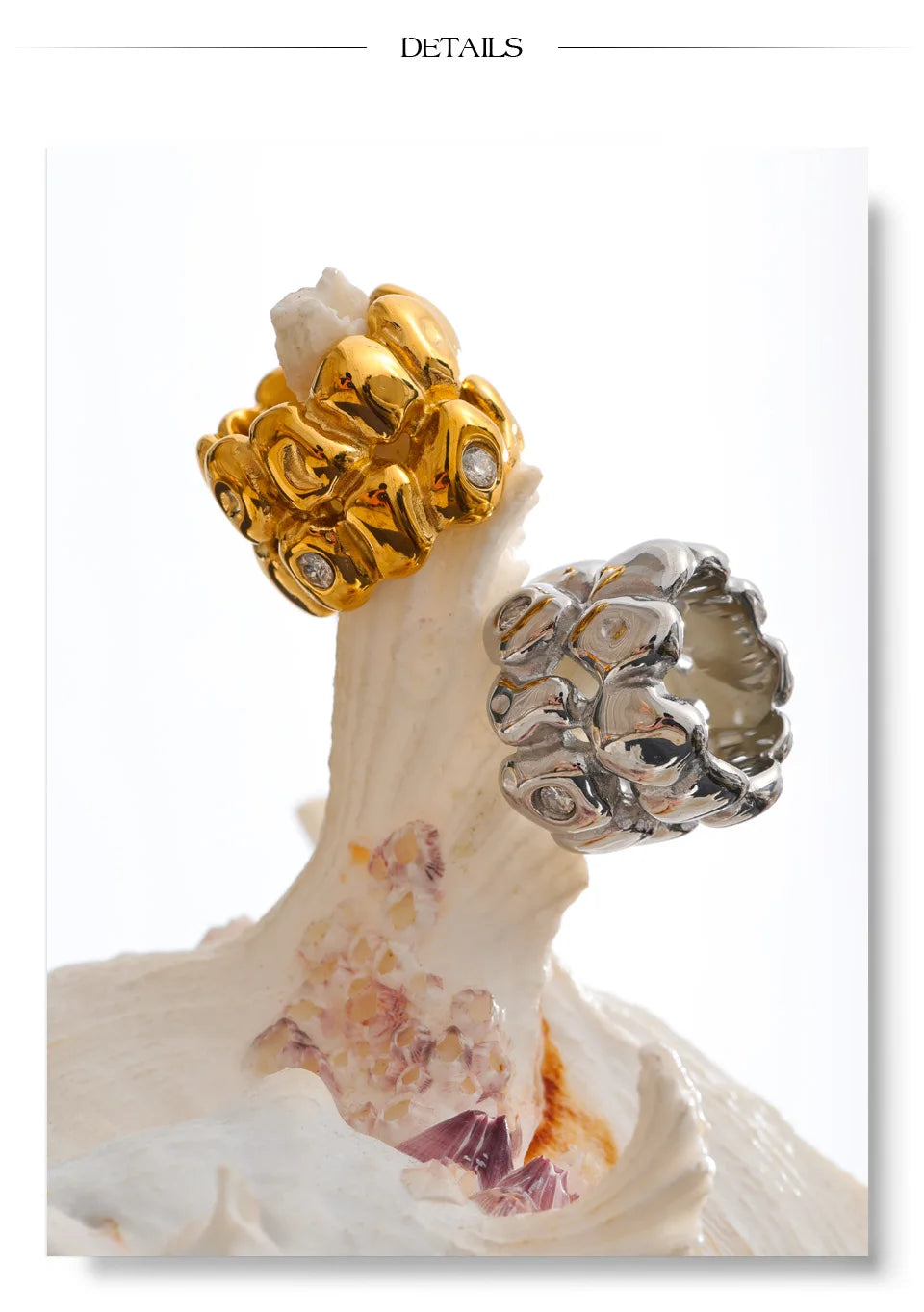 Cubic zirconia geometric ring in 18K gold-plated stainless steel with cubic zirconia.