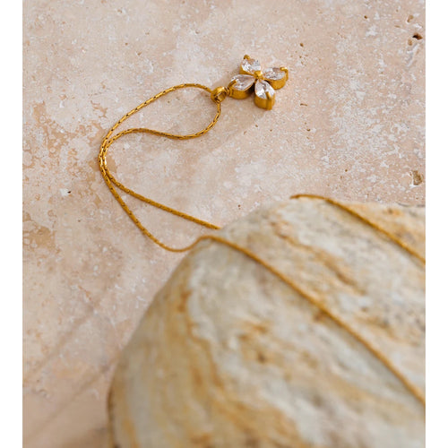 Cubic zirconia flower necklace in gold-plated stainless steel with cubic zirconia.
