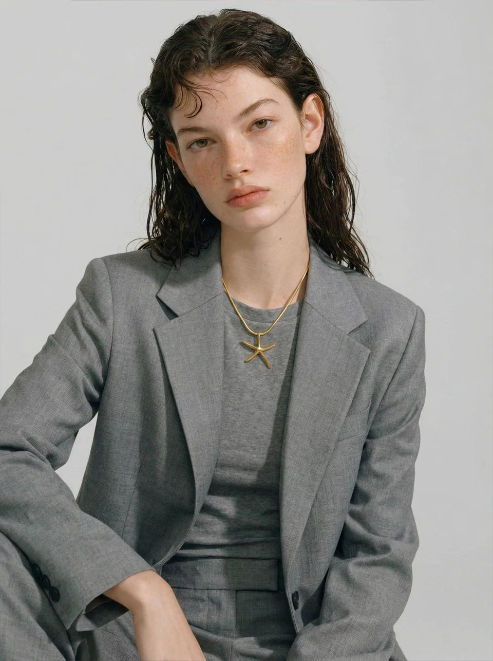 Star geometric necklace in gold-plated stainless steel.