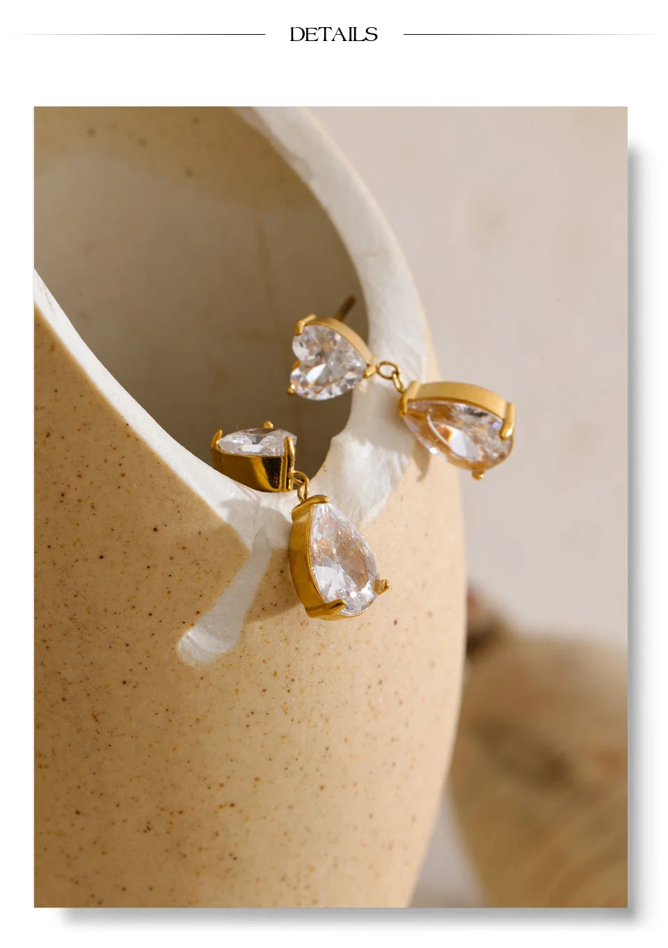 Cubic zirconia heart earrings in gold-plated stainless steel with cubic zirconia.