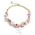 Shell star geometric necklace in gold-plated stainless steel with shell.