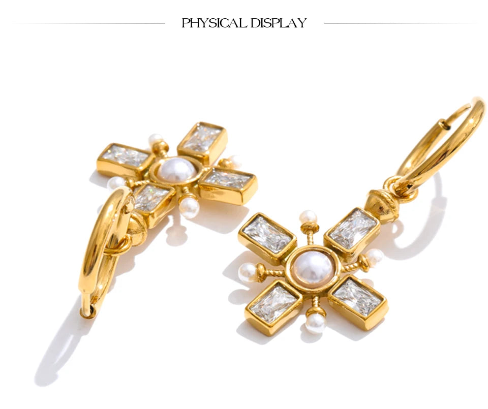 Cubic zirconia pearl cross earrings in gold-plated stainless steel with pearl and cubic zirconia.