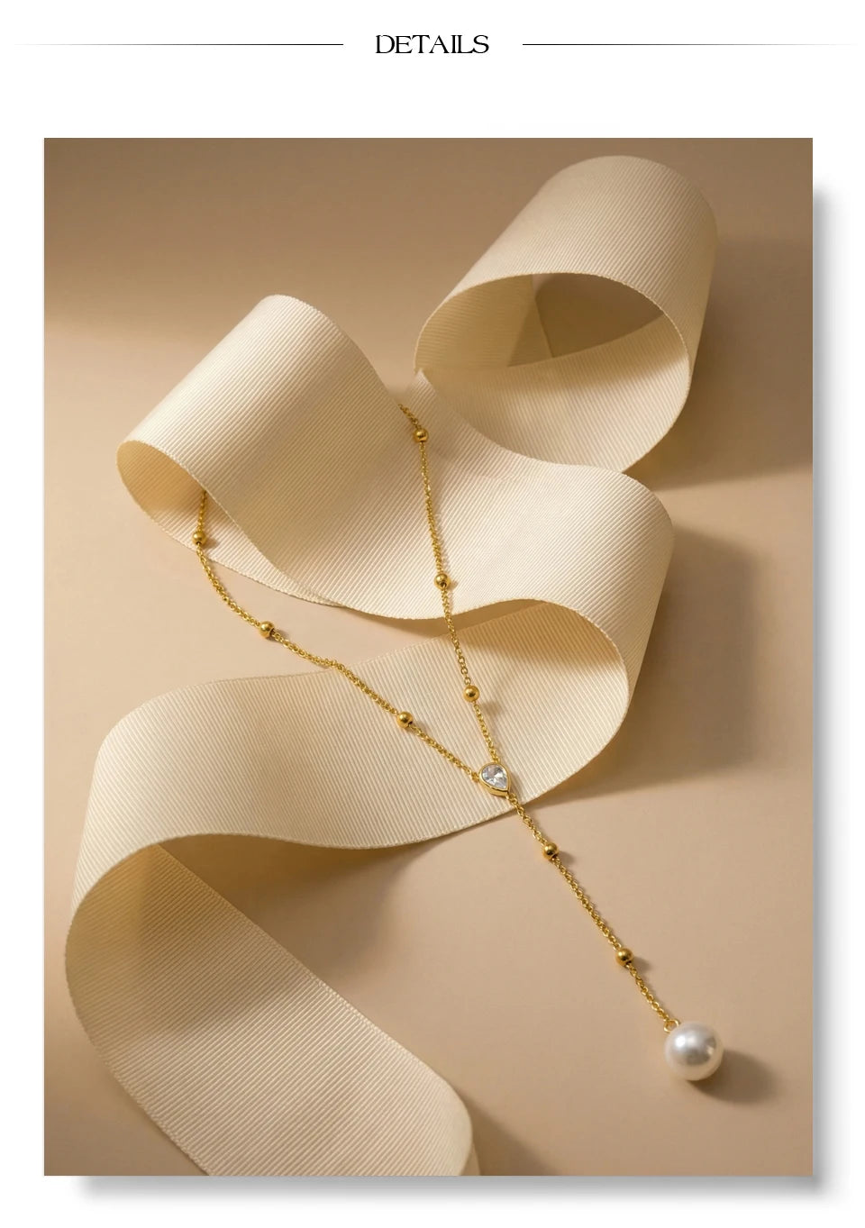 Cubic zirconia pearl geometric necklace in gold-plated stainless steel with pearl and cubic zirconia.