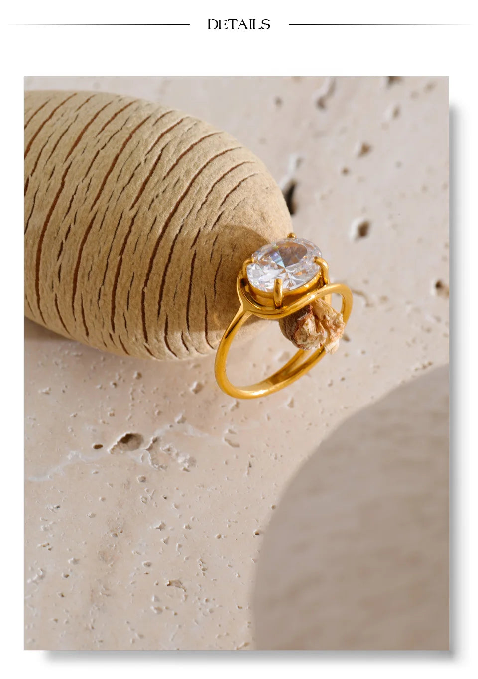 Cubic zirconia geometric ring in 18K gold-plated stainless steel with cubic zirconia.