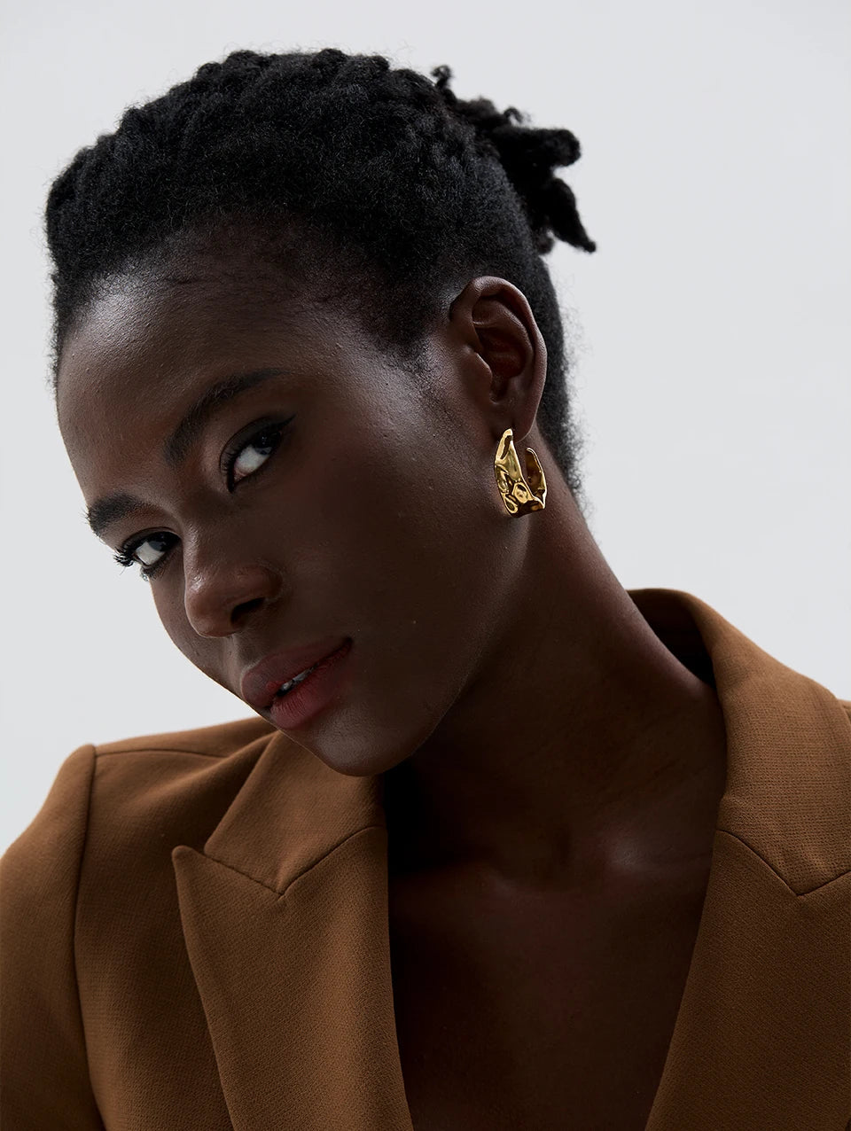 Geometric earrings in gold-plated 316L stainless steel.