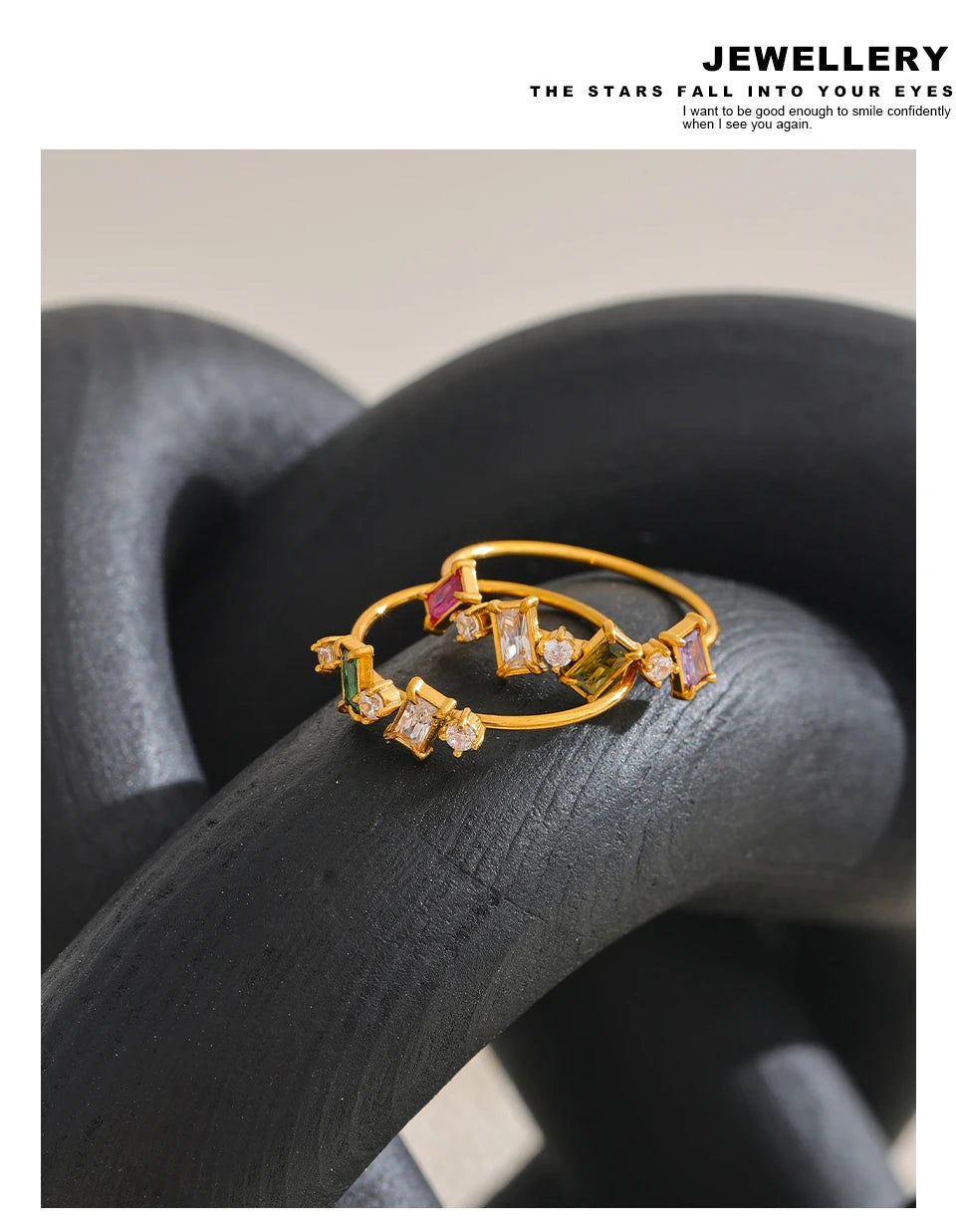 Cubic zirconia multi-color geometric ring in 18K gold-plated stainless steel with cubic zirconia.