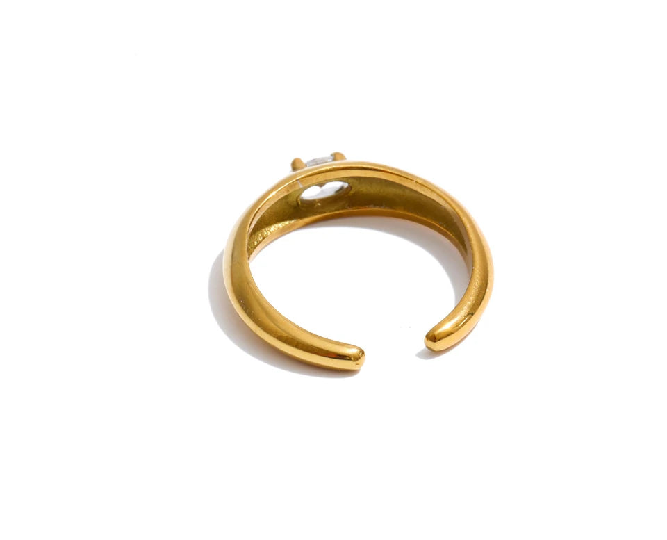 Cubic zirconia geometric ring in 18K gold-plated stainless steel with cubic zirconia.
