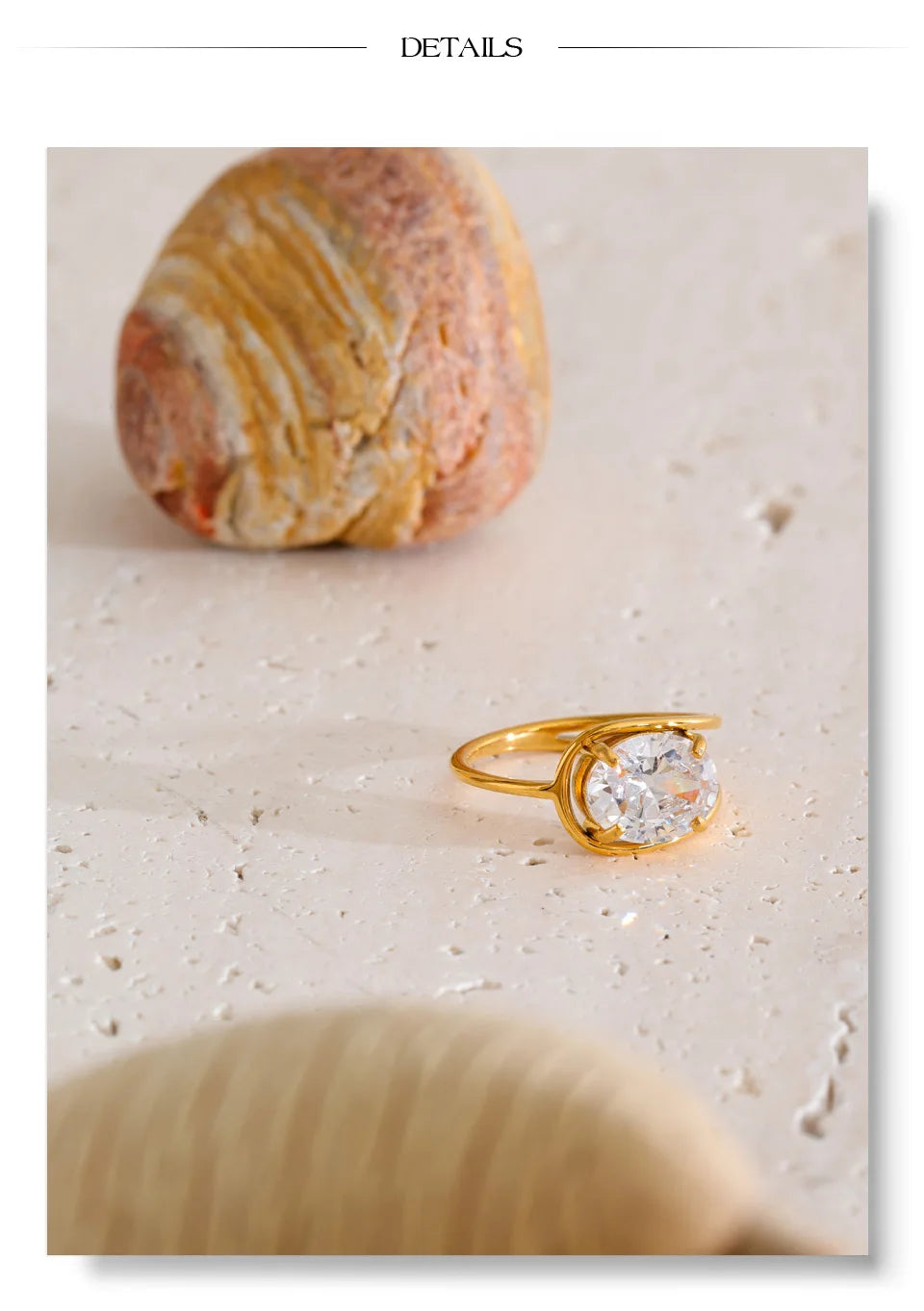 Cubic zirconia geometric ring in 18K gold-plated stainless steel with cubic zirconia.