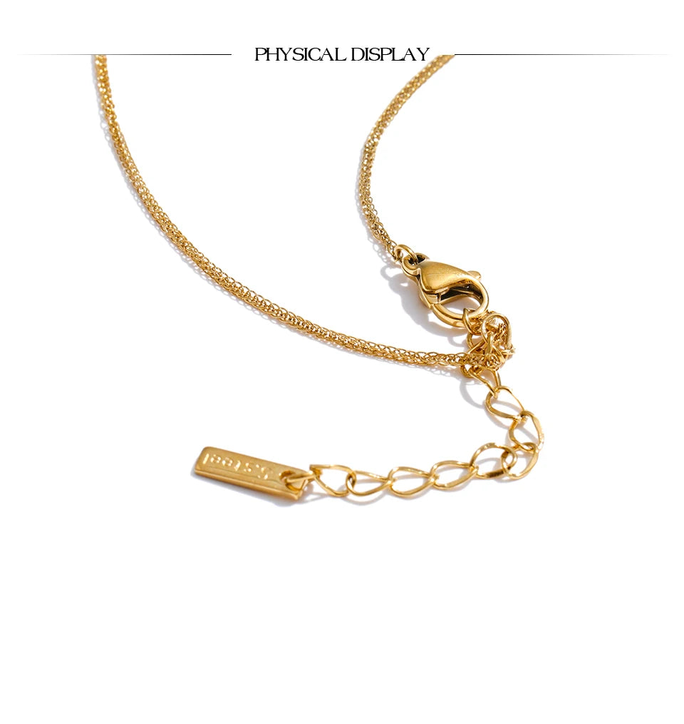Red enamel geometric necklace in gold-plated stainless steel with enamel.
