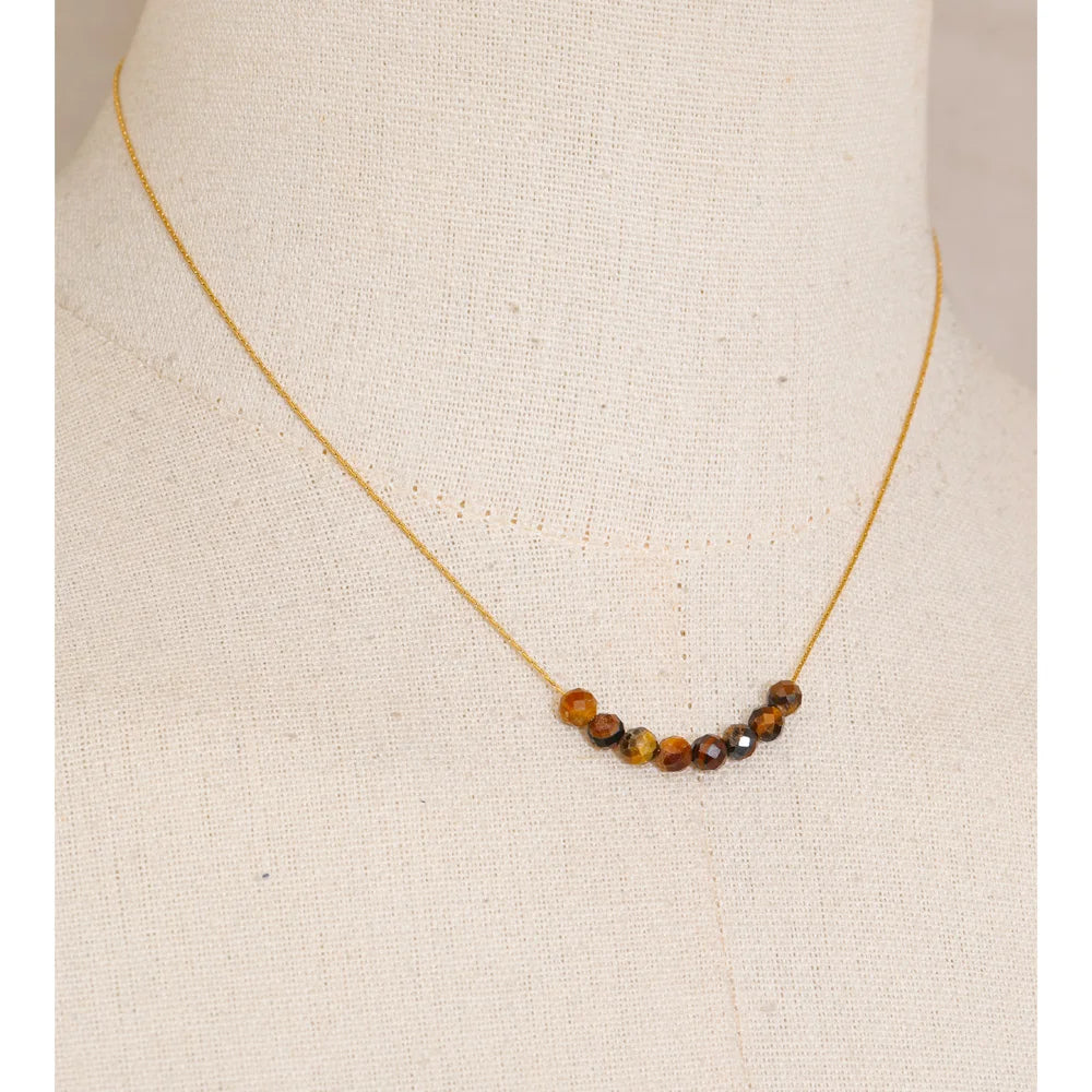 Natural stone beaded geometric necklace in gold-plated stainless steel with natural stone.
