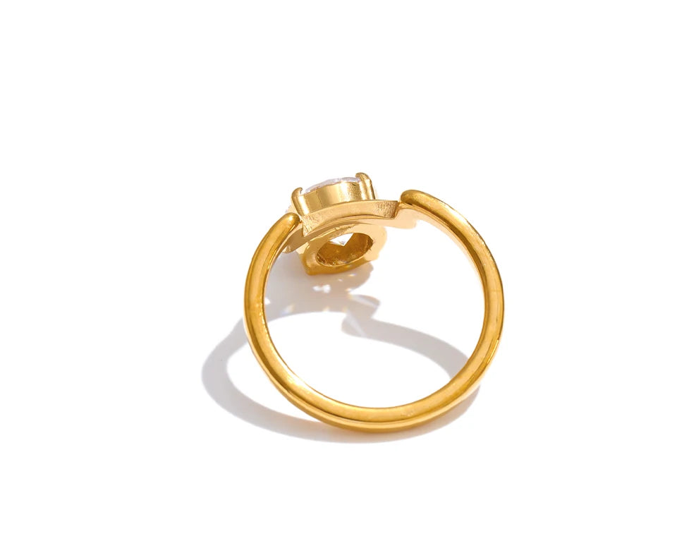 Cubic zirconia geometric ring in 18K gold-plated stainless steel with cubic zirconia.