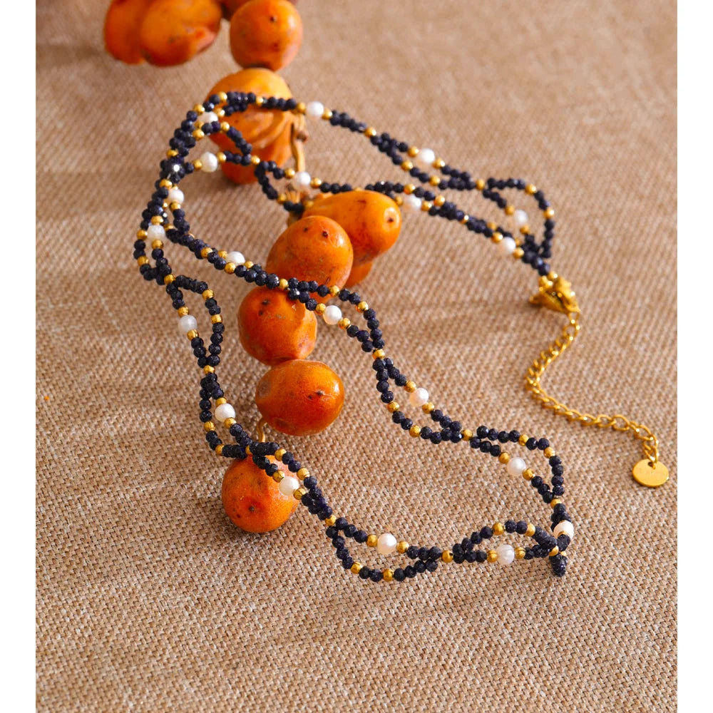 Pearl natural stone beaded necklace in gold-plated stainless steel with pearl and natural stone.