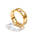 Cubic zirconia geometric ring in 18K gold-plated stainless steel with cubic zirconia.