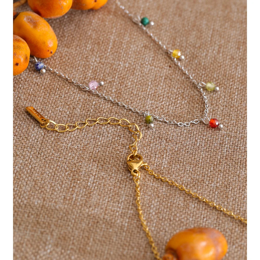 Cubic zirconia multi-color geometric necklace in gold-plated stainless steel with cubic zirconia.