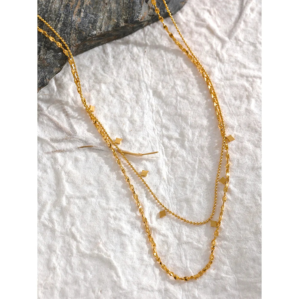 Geometric chain layered necklace in gold-plated stainless steel.