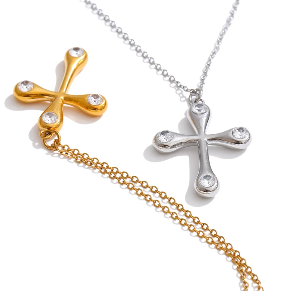 Cubic zirconia cross necklace in gold-plated stainless steel with cubic zirconia.