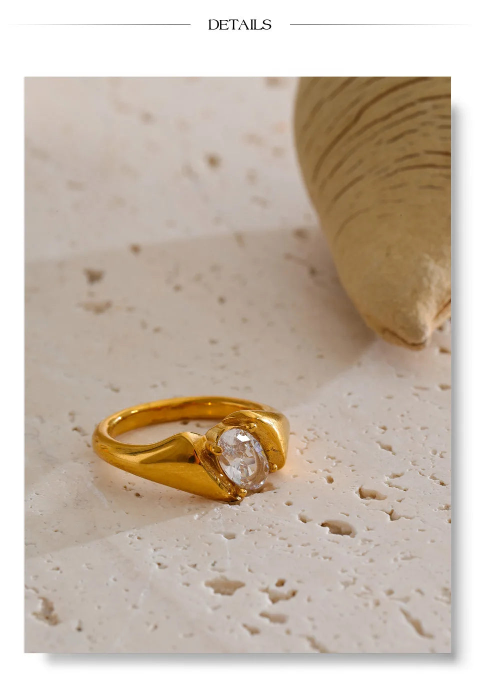 Cubic zirconia geometric ring in 18K gold-plated stainless steel with cubic zirconia.