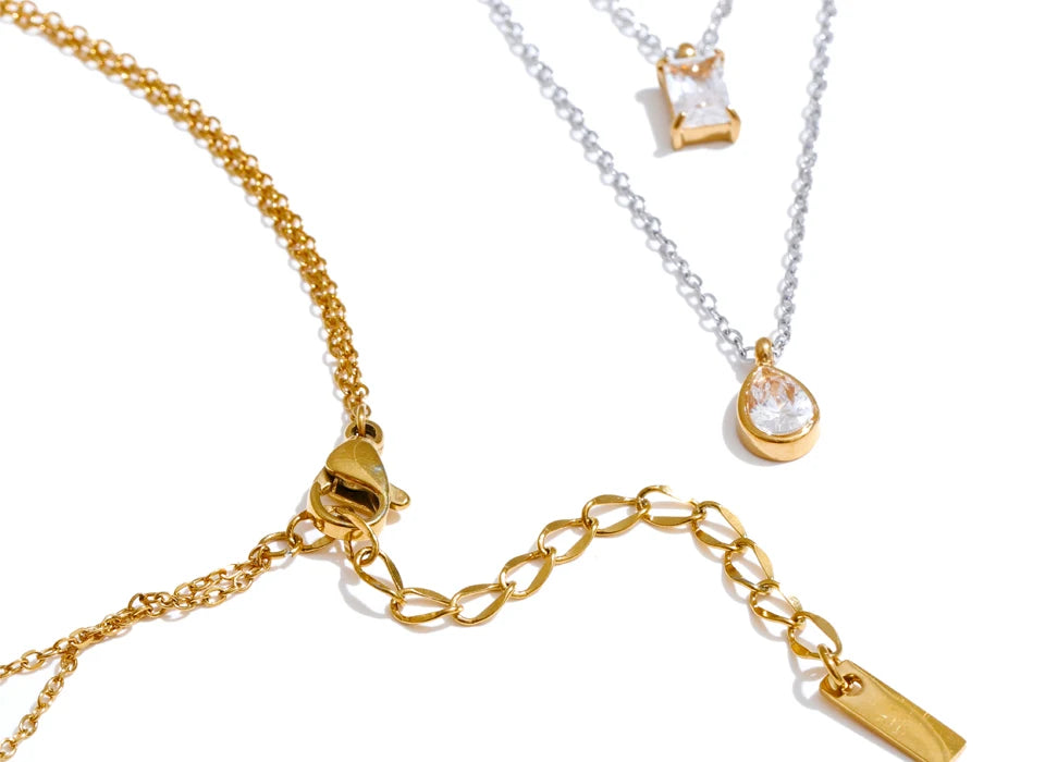 Cubic zirconia geometric layered necklace in gold-plated stainless steel with cubic zirconia.