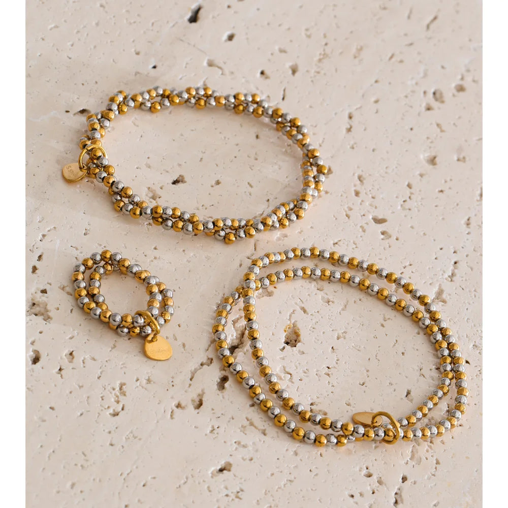 Beaded geometric bracelet in gold-plated stainless steel.