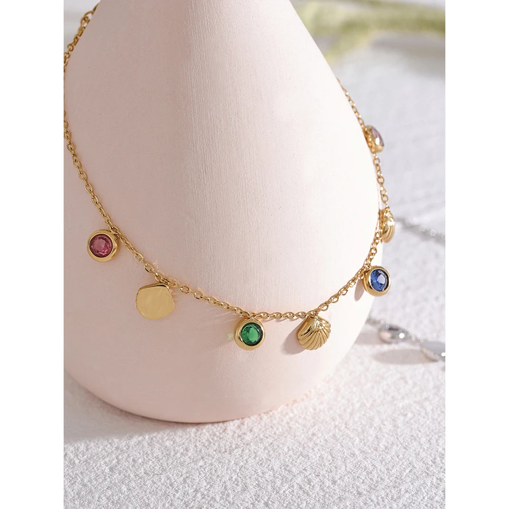 Cubic zirconia shell multi-color anklet in gold-plated stainless steel with cubic zirconia and shell.