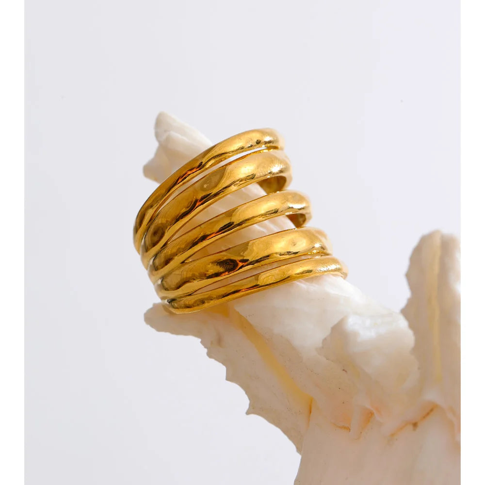 Geometric layered ring in 18K gold-plated stainless steel.