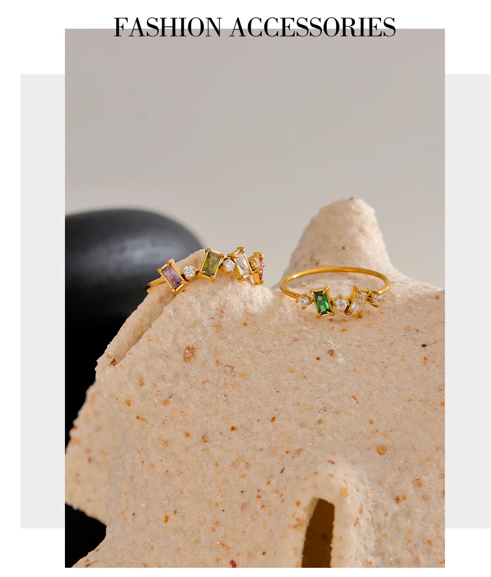 Cubic zirconia multi-color geometric ring in 18K gold-plated stainless steel with cubic zirconia.