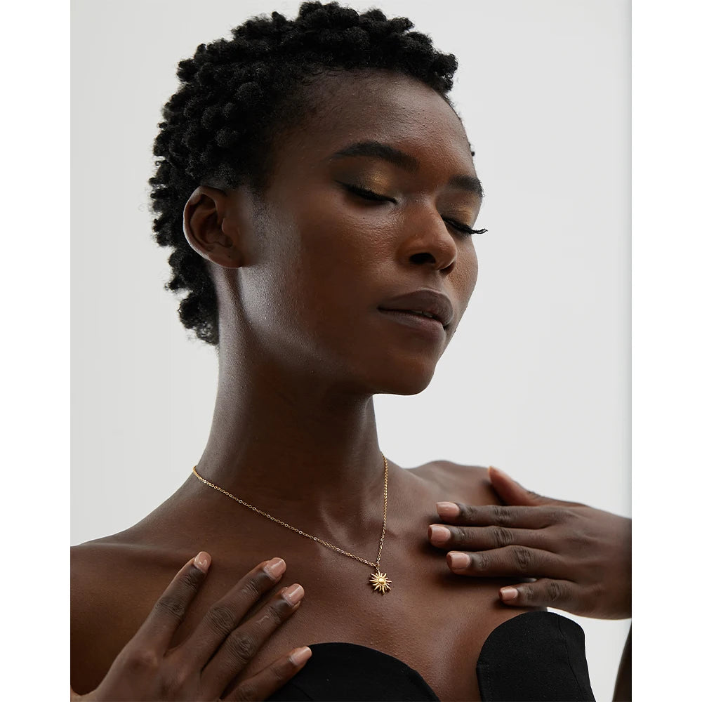 Sun geometric necklace in gold-plated stainless steel.