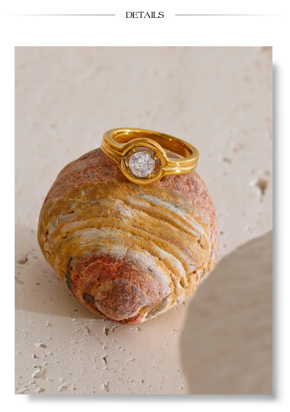 Cubic zirconia geometric ring in 18K gold-plated stainless steel with cubic zirconia.