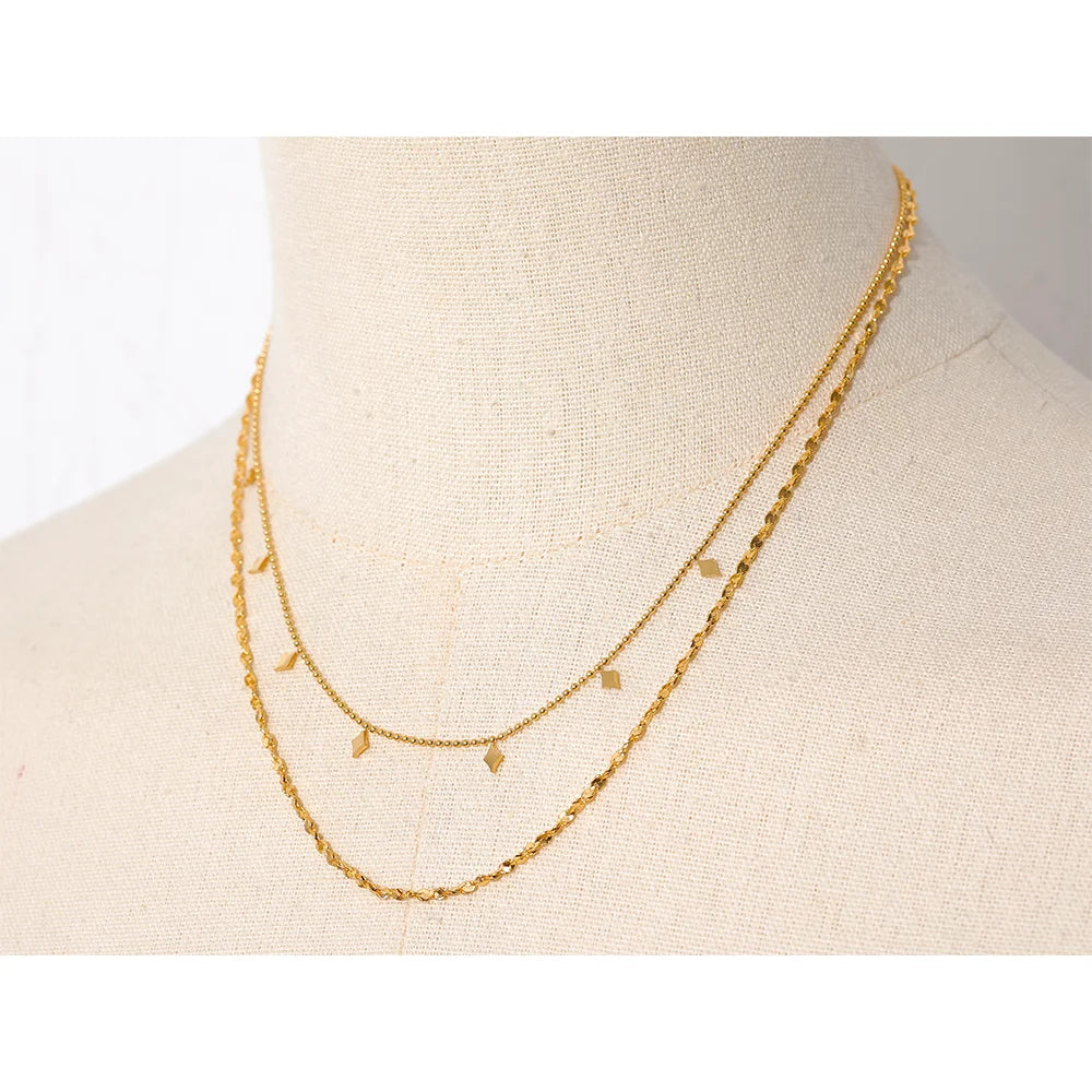 Geometric chain layered necklace in gold-plated stainless steel.