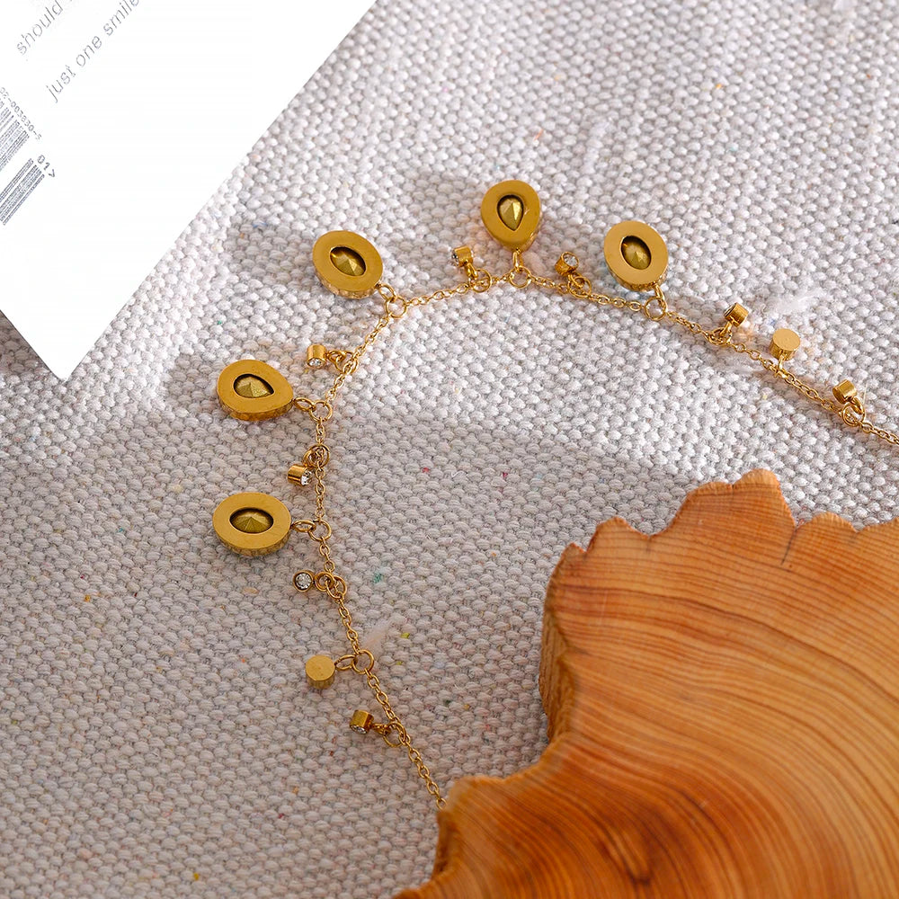 Cubic zirconia multi-color geometric necklace in gold-plated stainless steel with cubic zirconia.