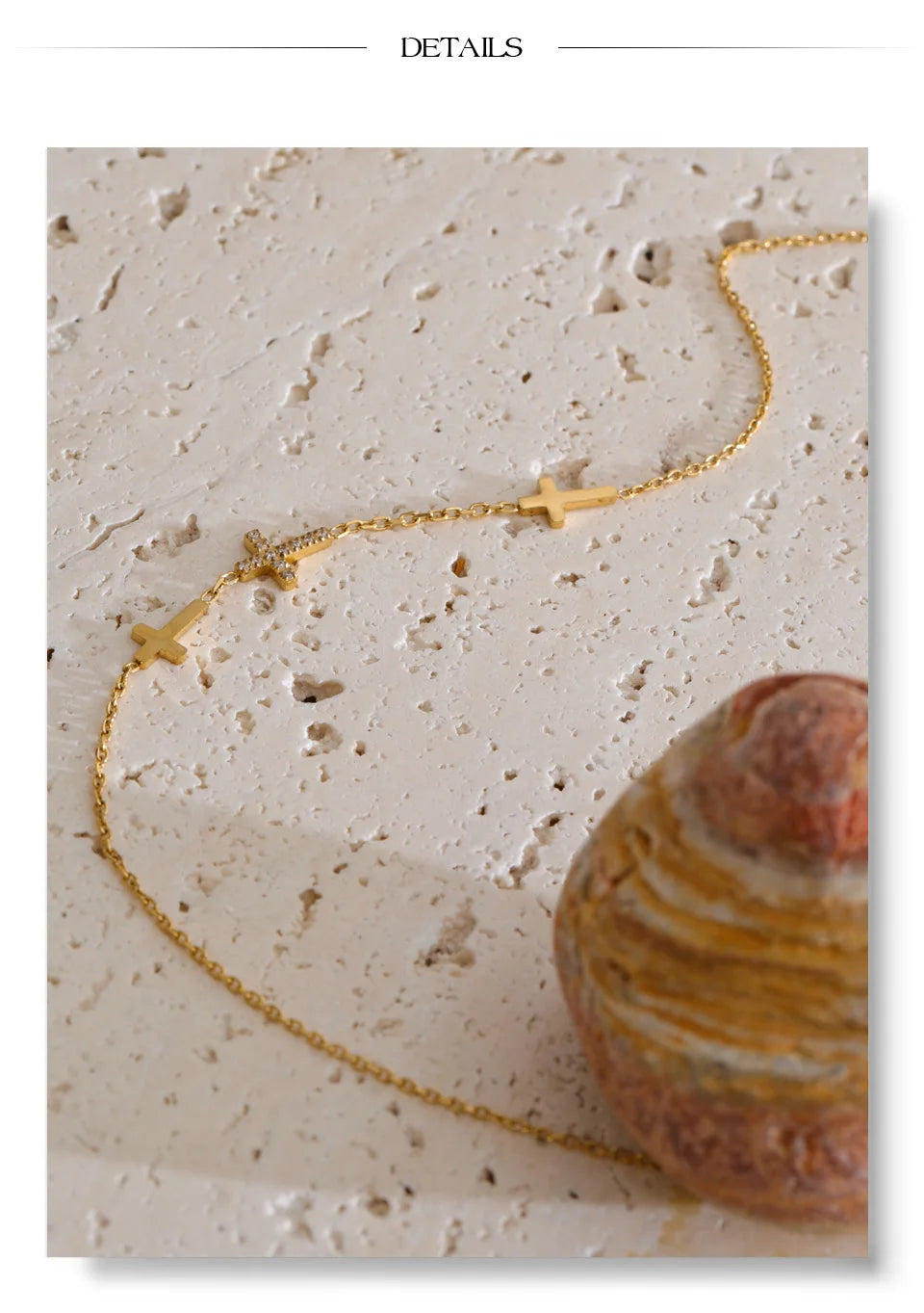Cubic zirconia cross geometric necklace in gold-plated stainless steel with cubic zirconia.