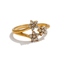 Cubic zirconia flower ring in 18K gold-plated stainless steel with cubic zirconia.