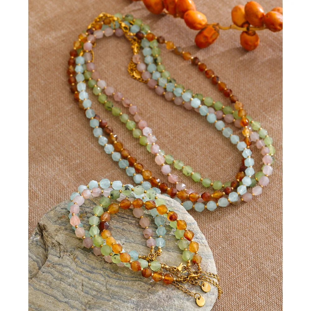 Natural stone beaded multi-color necklace in gold-plated stainless steel with natural stone.
