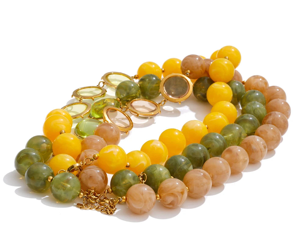 Resin acrylic beaded necklace in gold-plated stainless steel with resin and acrylic.