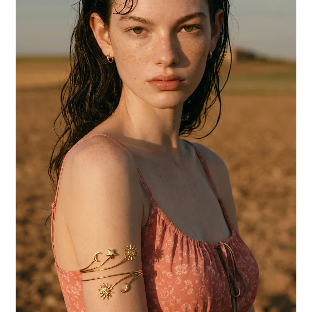 Star moon sun bracelet in gold-plated stainless steel.