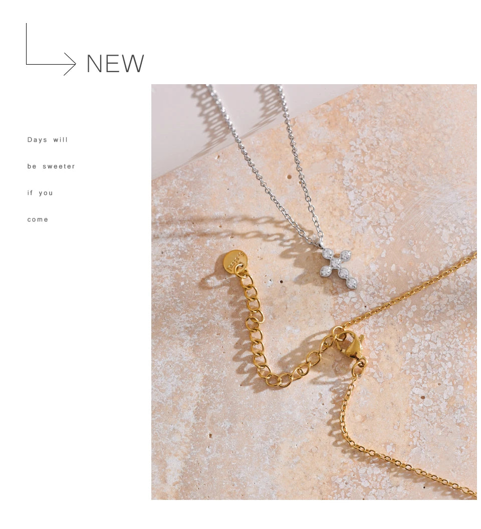Cubic zirconia cross geometric necklace in gold-plated stainless steel with cubic zirconia.
