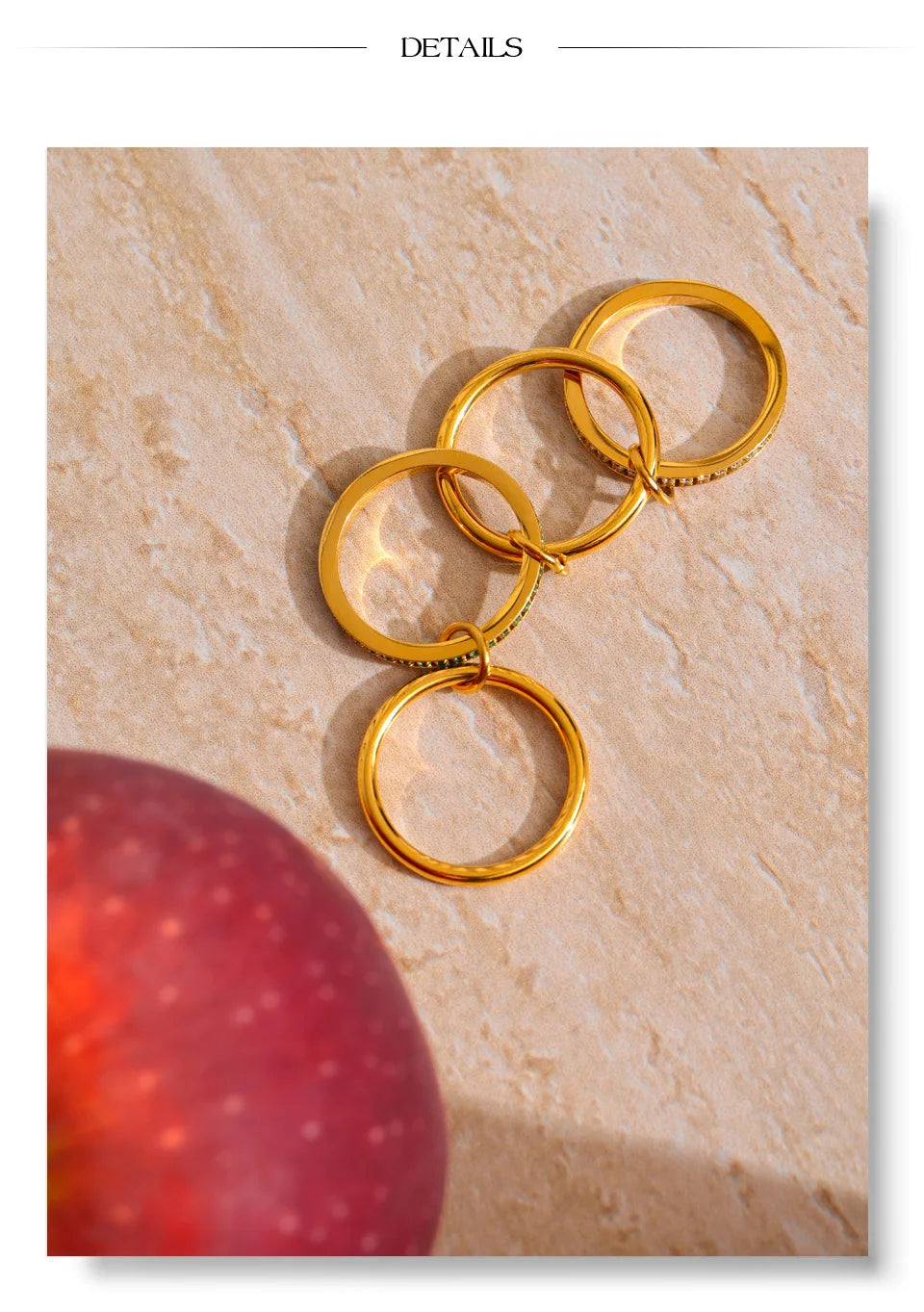 White cubic zirconia geometric ring in 18K gold-plated stainless steel with cubic zirconia.