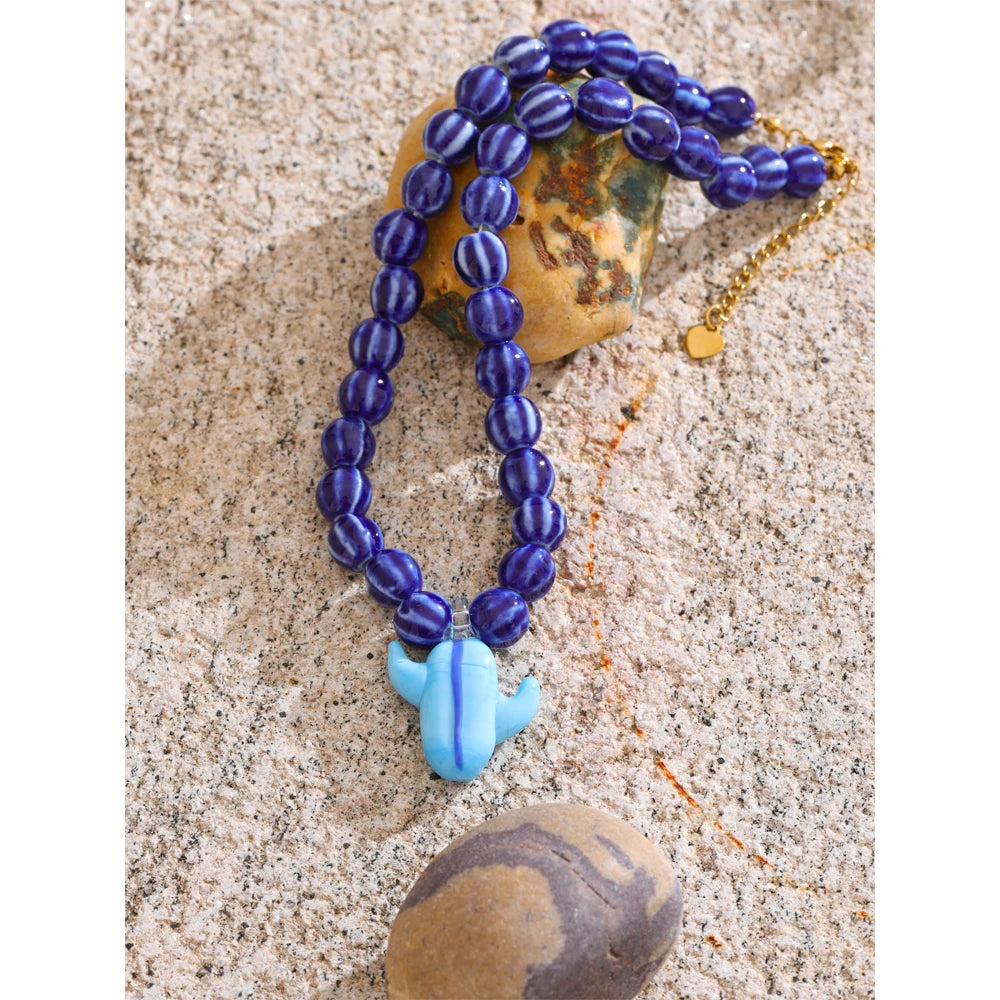 Blue beaded geometric necklace in gold-plated stainless steel.